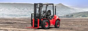 4-Wheel Drive Rough Terrain Forklift Truck in an open space, mountain as background