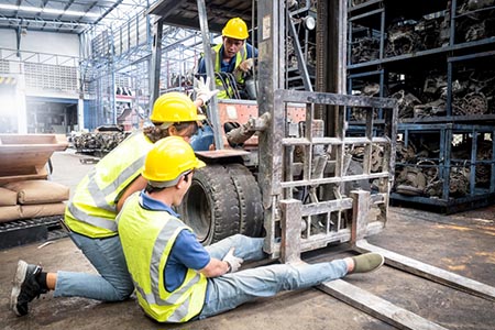 warehouse worker accidentally trapped in the wheel of a forklift